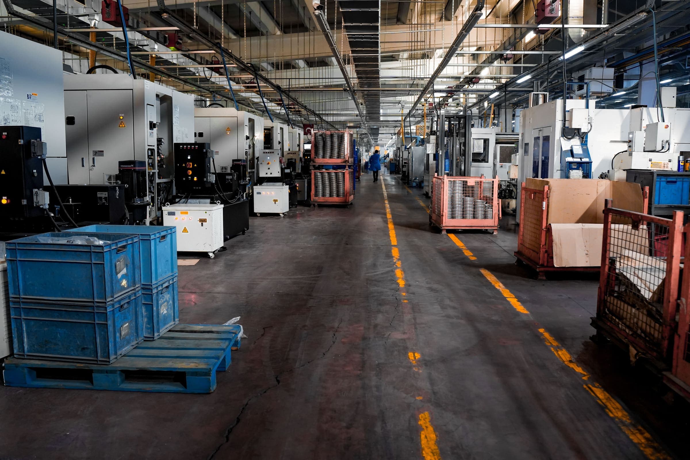 Machining hall with crates of finished parts