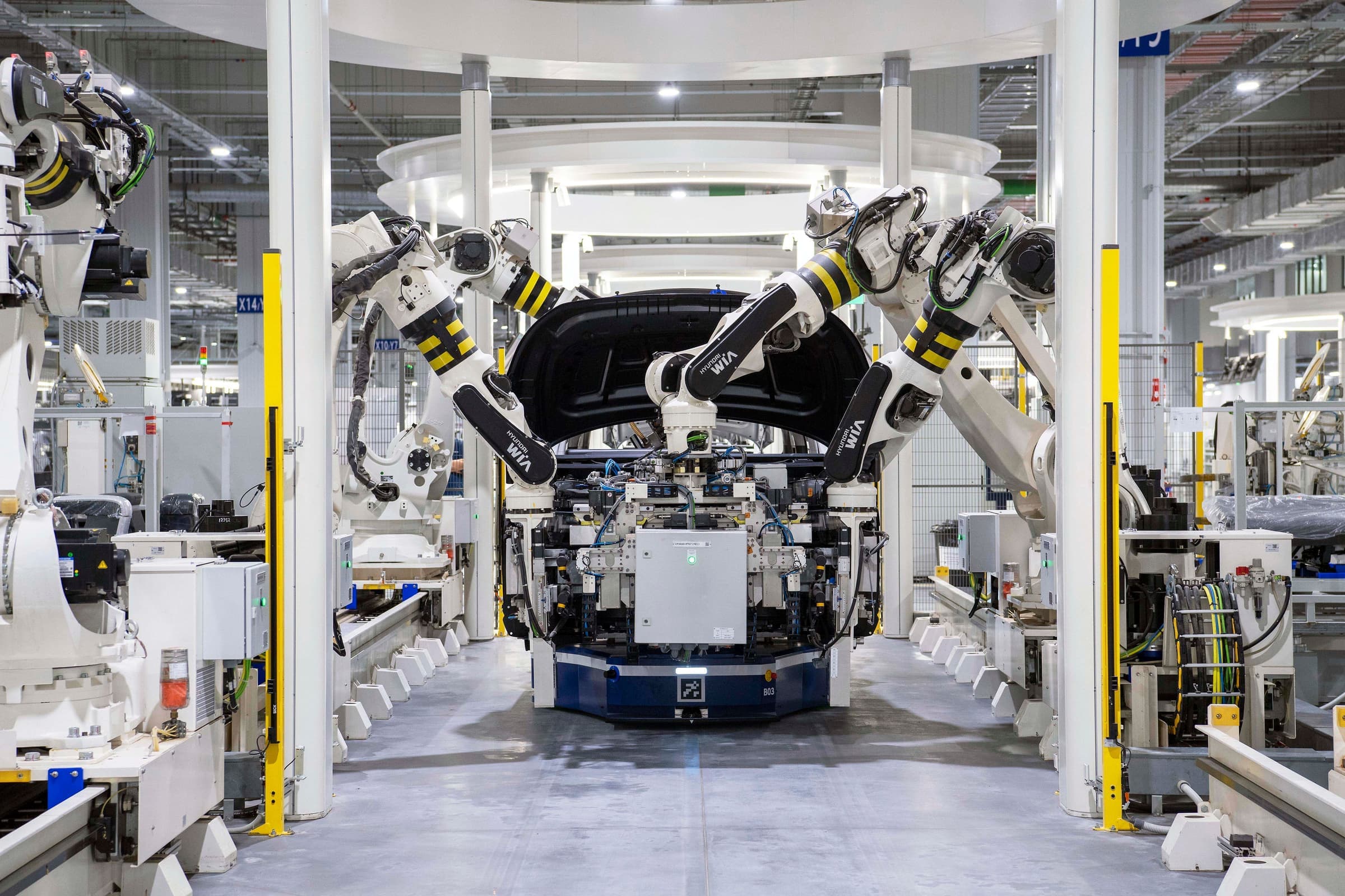 Robotic assembly cell building a car body
